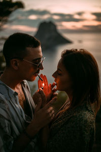 Portrait of couple kissing outdoors