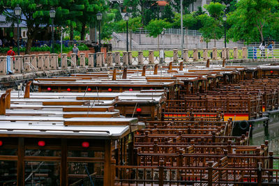 Row of anchored bum boats on singapore river.