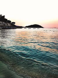 Scenic view of sea against clear sky during sunset