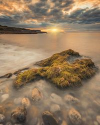 Scenic view of sea against dramatic sky