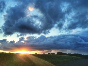 Scenic view of landscape against cloudy sky