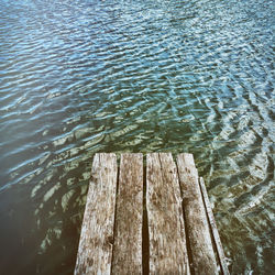 High angle view of wooden jetty over lake