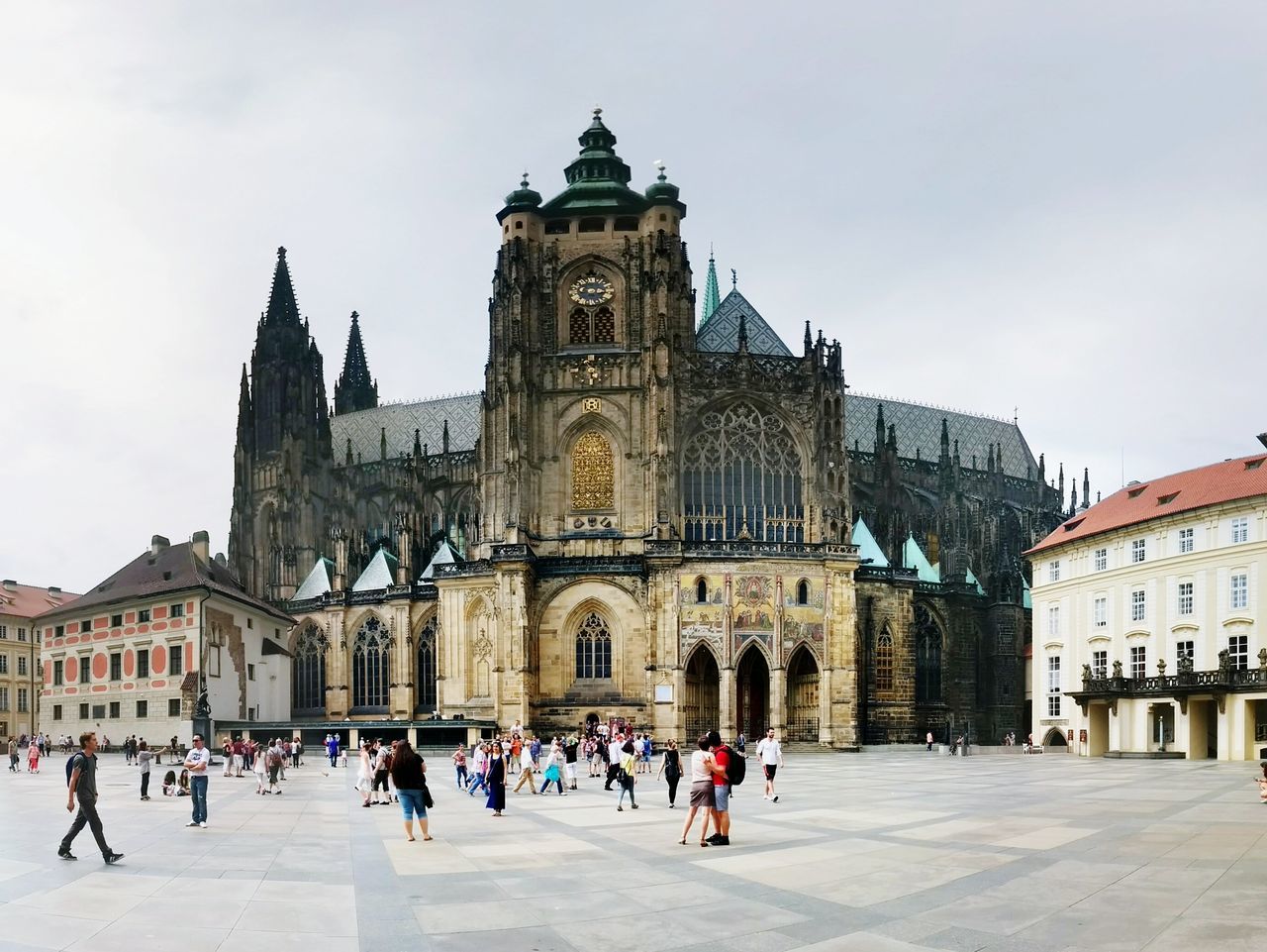 architecture, building exterior, built structure, large group of people, history, facade, sky, travel destinations, religion, place of worship, famous place, tourism, church, city, town square, person, travel, spirituality