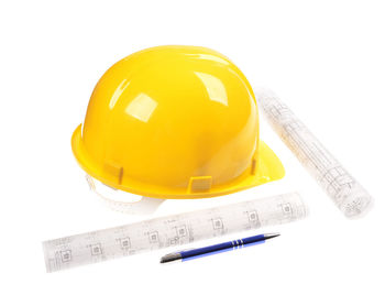 Close-up of yellow hat against white background