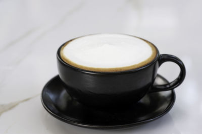 High angle view of coffee cup on table