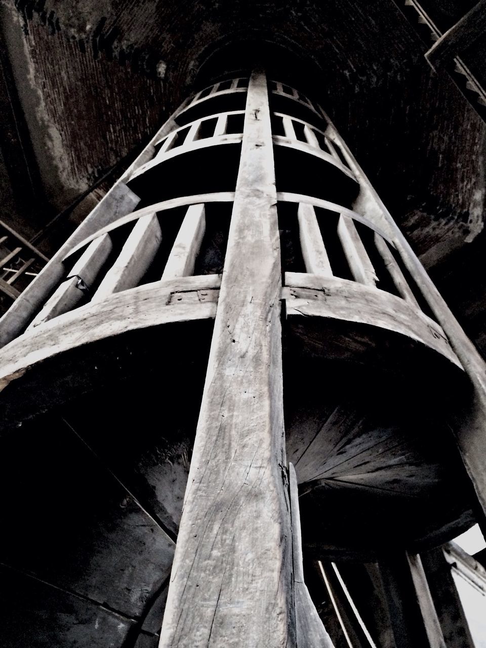 built structure, architecture, steps, steps and staircases, low angle view, staircase, railing, building exterior, high angle view, old, no people, wood - material, building, outdoors, day, sunlight, metal, abandoned, reflection, stairs