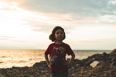 Man standing at beach against sky