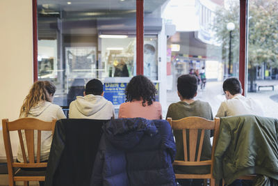 Rear view of people sitting in restaurant