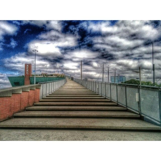 sky, cloudy, cloud - sky, the way forward, railing, overcast, built structure, diminishing perspective, architecture, weather, cloud, storm cloud, vanishing point, day, long, transfer print, outdoors, auto post production filter, nature, no people