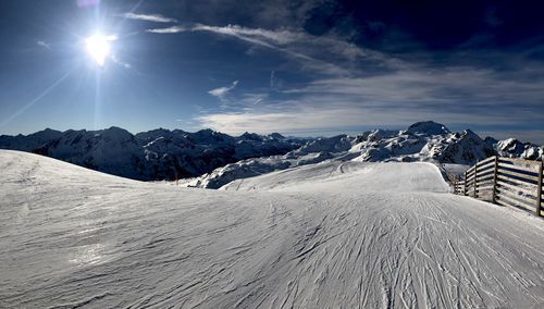 Scenic view of snowcapped mountains against sky