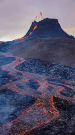 Smoke emitting from volcanic mountain at night