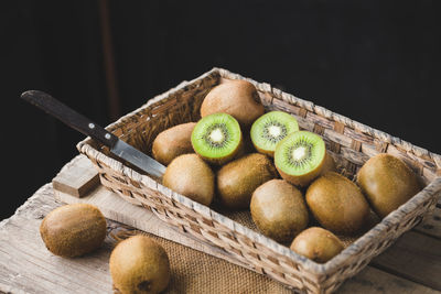 Close-up of fruits in basket on table