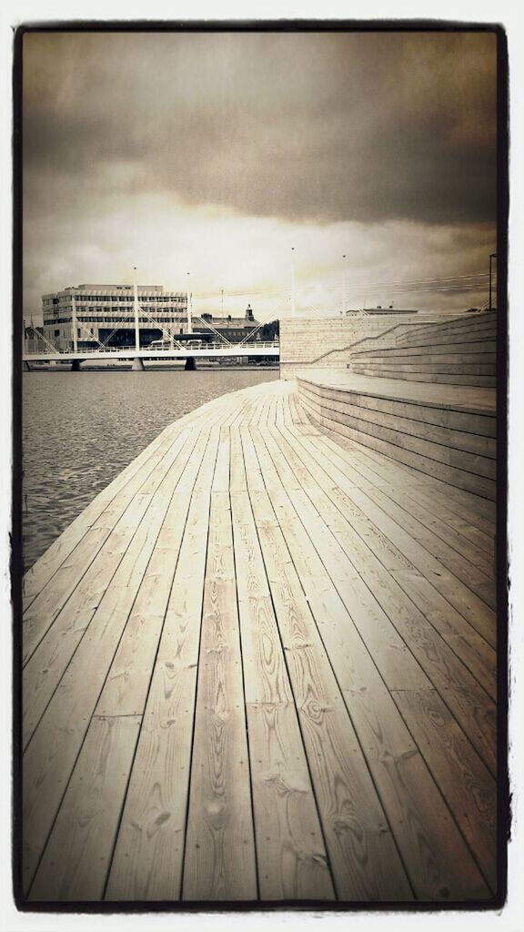 transfer print, auto post production filter, wood - material, sky, wooden, wood, built structure, boardwalk, cloud - sky, pier, plank, outdoors, day, architecture, no people, beach, nature, tranquility, sand, tranquil scene