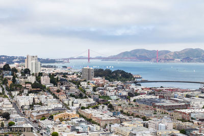 Aerial view of city and buildings against sky