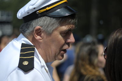 Close-up of man talking with woman 