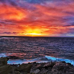 Scenic view of sea against cloudy sky