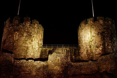 Low angle view of historical building at night