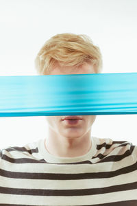 Close-up portrait of man against white background