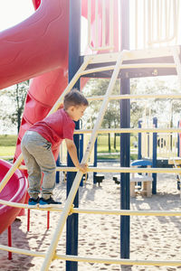 Boy playing in playground