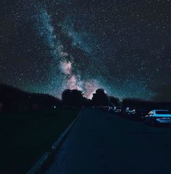 Road against sky at night