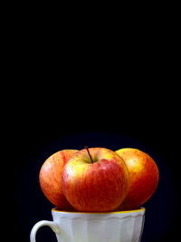 Close-up of apple on black background