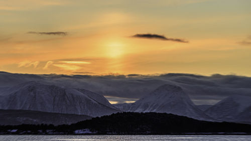 Scenic view of mountains against sky during sunset