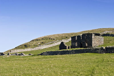 Old ruin building against clear sky