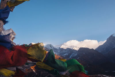 Scenic view of snowcapped mountains against clear blue sky