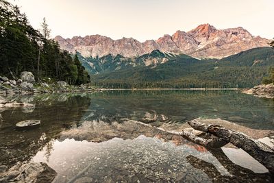 Scenic view of lake and mountains against sky