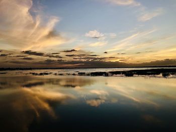 Scenic view of sea against sky at sunset