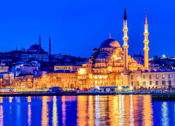 Reflection of illuminated buildings in city