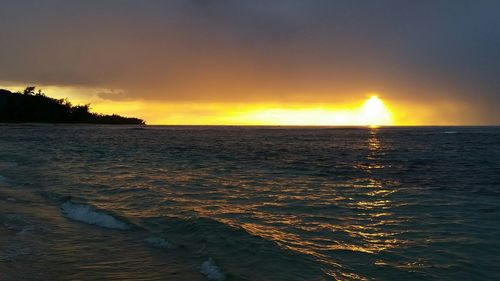 Scenic view of sea at sunset