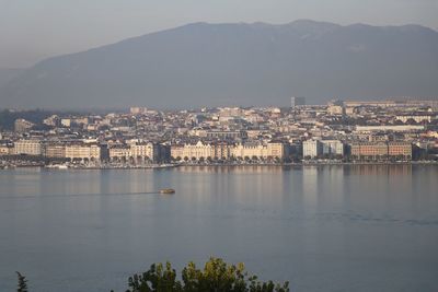 High angle view of buildings and mountains against sky