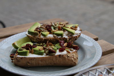 Close-up of avocado bread food in plate on table