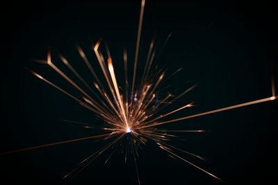 Close-up of firework display against sky at night