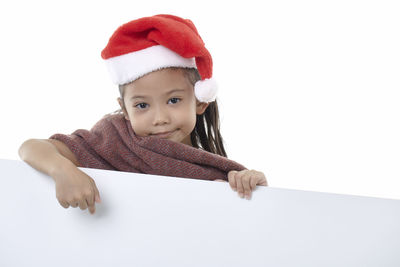 Portrait of cute baby boy against white background