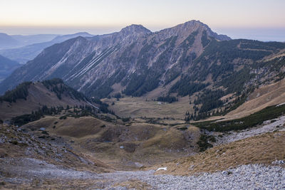 Scenic view of landscape and mountains against sky