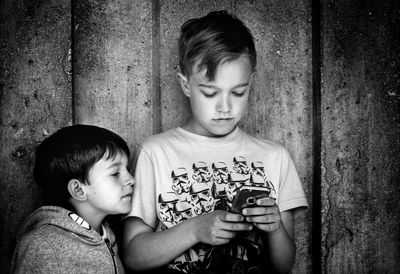 Portrait of boy and daughter outdoors