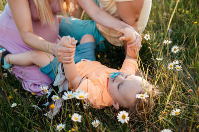 Low section of women on grassy field