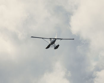 Low angle view of airplane against sky