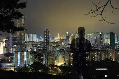 View of skyscrapers lit up at night