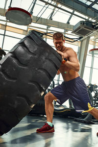 Low section of woman exercising in gym