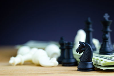 Close-up of chess pieces on table