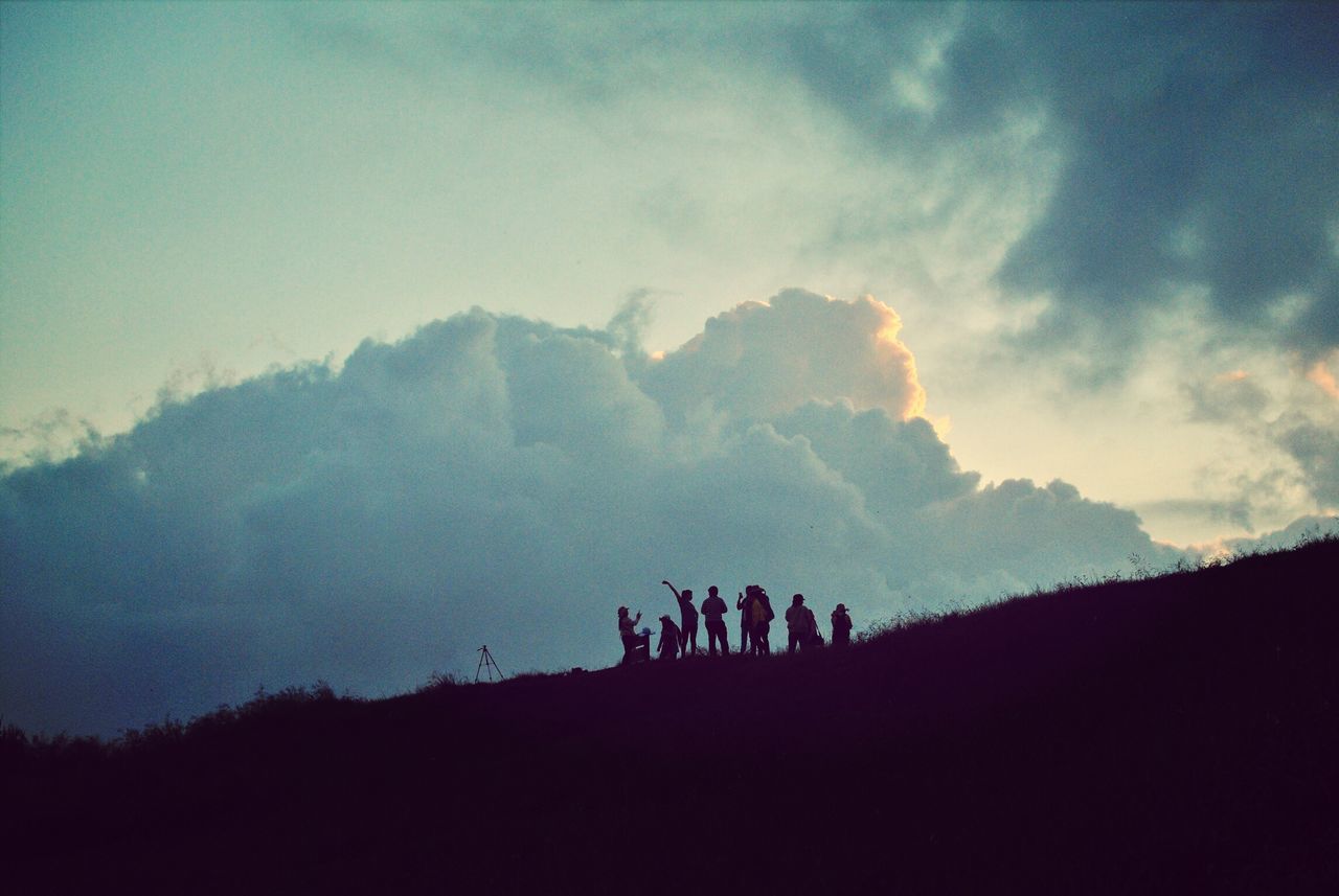 silhouette, sky, mountain, scenics, men, leisure activity, tranquil scene, landscape, lifestyles, cloud - sky, beauty in nature, tranquility, nature, mountain range, large group of people, togetherness, non-urban scene, person, vacations