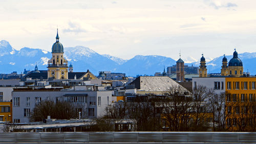 Buildings against sky in city during winter