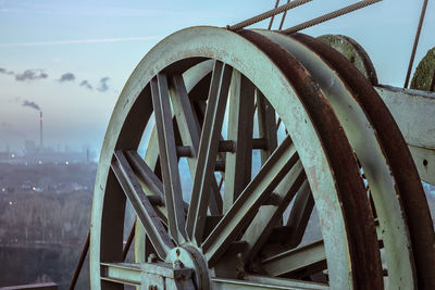 Close-up of huge metallic wheel