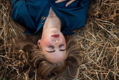 Woman lying on field