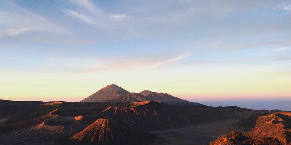 Scenic view of mountain against sky during sunset