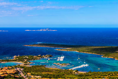 High angle view of sea against blue sky