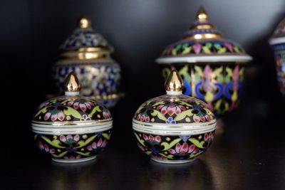 Close-up of colorful containers on table